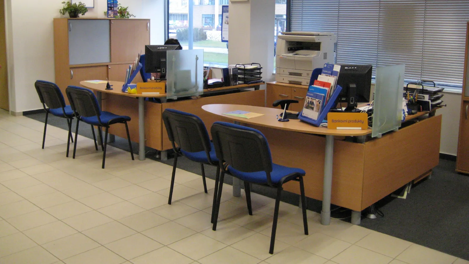 Stalinist residue. Furniture and layout carried a totalitarian power dynamic, putting staff and customers on opposite sides of the desk.